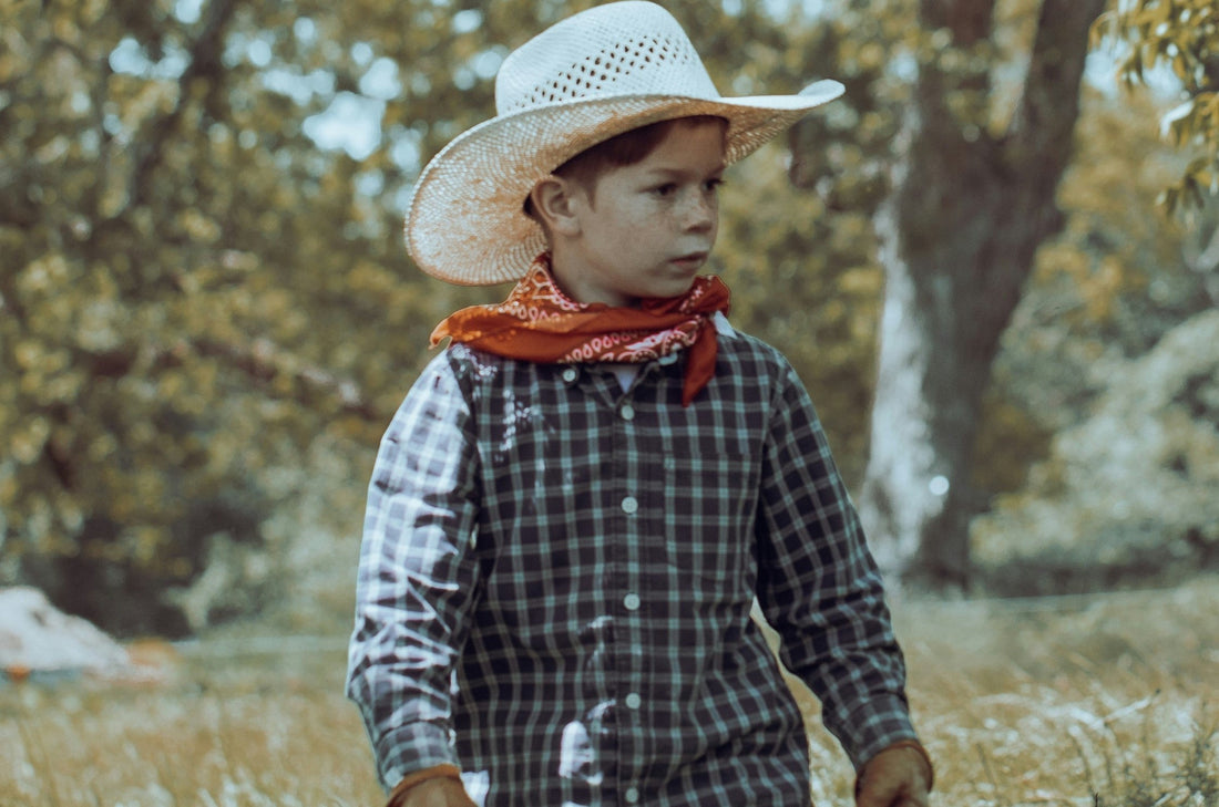 A kid in a cowboy costume.